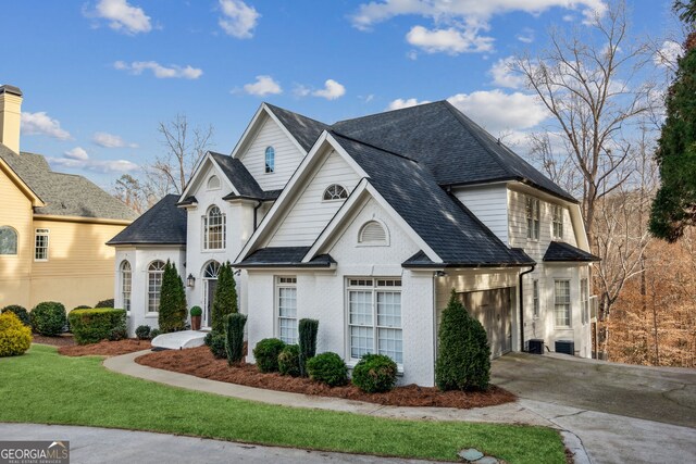 8625 Anchor On Lanier Ct, Gainesville, GA 30506 - french country home featuring driveway, an attached garage, roof with shingles, and central AC unit