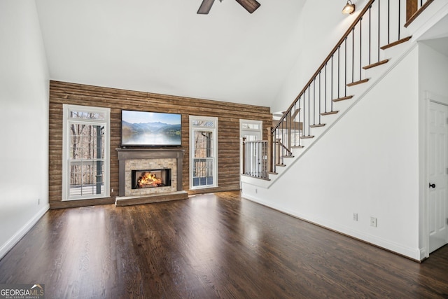 8625 Anchor On Lanier Ct, Gainesville, GA 30506 - unfurnished living room with high vaulted ceiling, healthy amount of natural light, baseboards, ceiling fan, and stairway