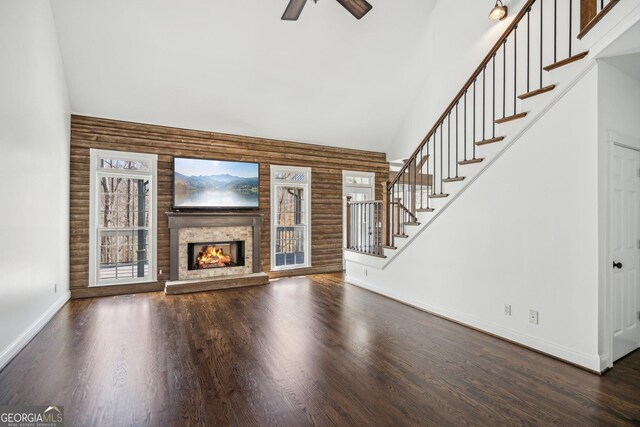 8625 Anchor On Lanier Ct, Gainesville, GA 30506 - unfurnished living room with high vaulted ceiling, healthy amount of natural light, baseboards, ceiling fan, and stairs