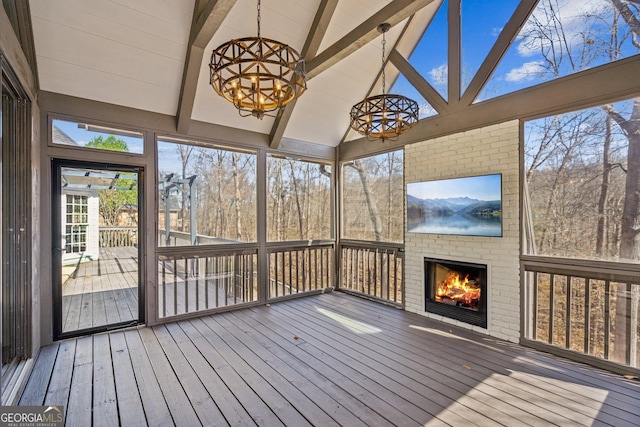 8625 Anchor On Lanier Ct, Gainesville, GA 30506 - unfurnished sunroom featuring a fireplace and a chandelier