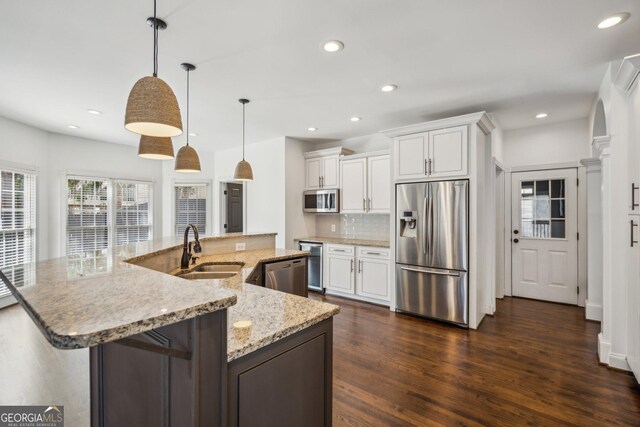 8625 Anchor On Lanier Ct, Gainesville, GA 30506 - kitchen with appliances with stainless steel finishes, a sink, backsplash, recessed lighting, and dark wood-type flooring