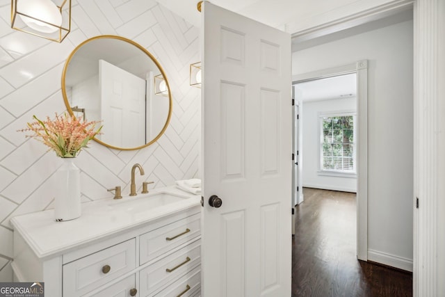 8625 Anchor On Lanier Ct, Gainesville, GA 30506 - bathroom with tasteful backsplash, vanity, wood finished floors, and baseboards