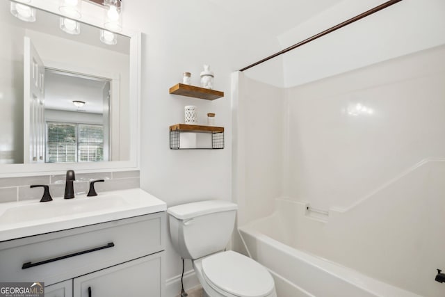 8625 Anchor On Lanier Ct, Gainesville, GA 30506 - bathroom with toilet, vanity, shower / washtub combination, and tasteful backsplash