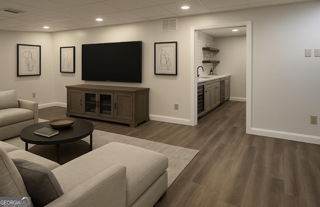 8625 Anchor On Lanier Ct, Gainesville, GA 30506 - living area featuring wet bar, baseboards, dark wood-style floors, beverage cooler, and a paneled ceiling