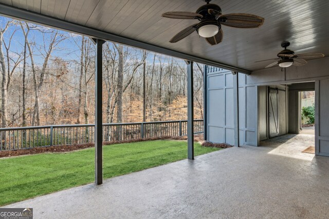 8625 Anchor On Lanier Ct, Gainesville, GA 30506 - unfurnished sunroom with a ceiling fan and a forest view