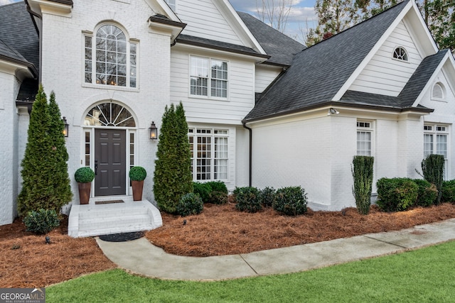 8625 Anchor On Lanier Ct, Gainesville, GA 30506 - french country style house featuring brick siding and roof with shingles
