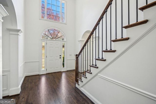 8625 Anchor On Lanier Ct, Gainesville, GA 30506 - foyer entrance with wood finished floors, arched walkways, stairway, and a high ceiling