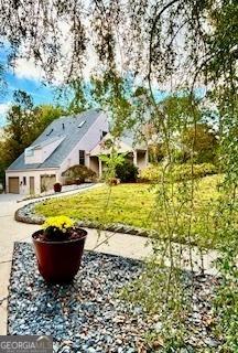 3810 Galloway Dr NE, Roswell, GA 30075 - view of yard featuring a garage and driveway