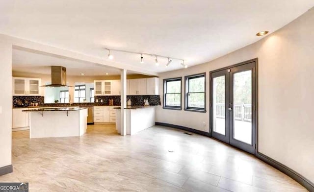 3810 Galloway Dr NE, Roswell, GA 30075 - unfurnished living room featuring french doors, track lighting, and baseboards