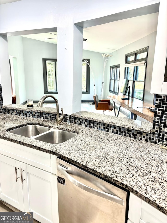 3810 Galloway Dr NE, Roswell, GA 30075 - kitchen featuring stainless steel dishwasher, a sink, decorative backsplash, and stone countertops