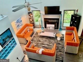 3810 Galloway Dr NE, Roswell, GA 30075 - living area featuring a fireplace and ceiling fan