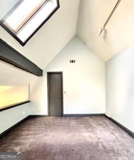 3810 Galloway Dr NE, Roswell, GA 30075 - bonus room with carpet floors, a skylight, baseboards, and high vaulted ceiling