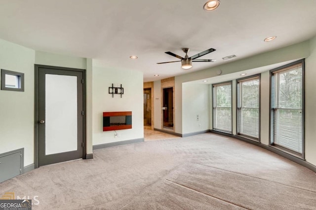 3810 Galloway Dr NE, Roswell, GA 30075 - unfurnished living room featuring light carpet, recessed lighting, baseboards, a ceiling fan, and a fireplace