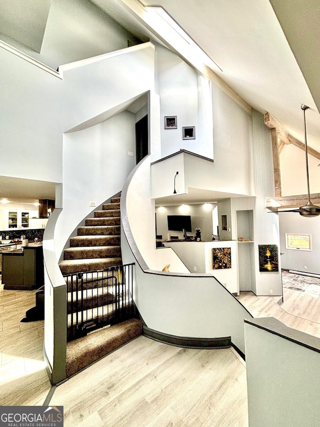 3810 Galloway Dr NE, Roswell, GA 30075 - stairway with high vaulted ceiling and wood finished floors