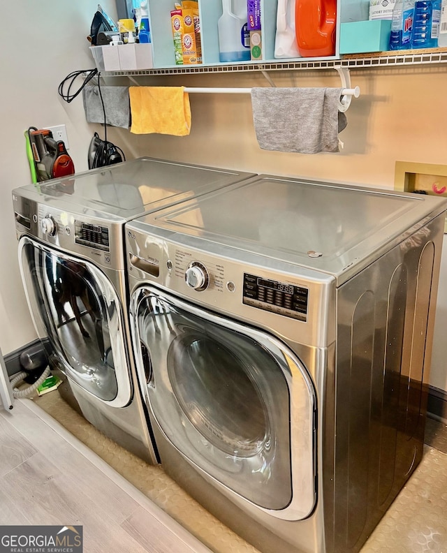 3810 Galloway Dr NE, Roswell, GA 30075 - clothes washing area with washer and dryer and wood finished floors