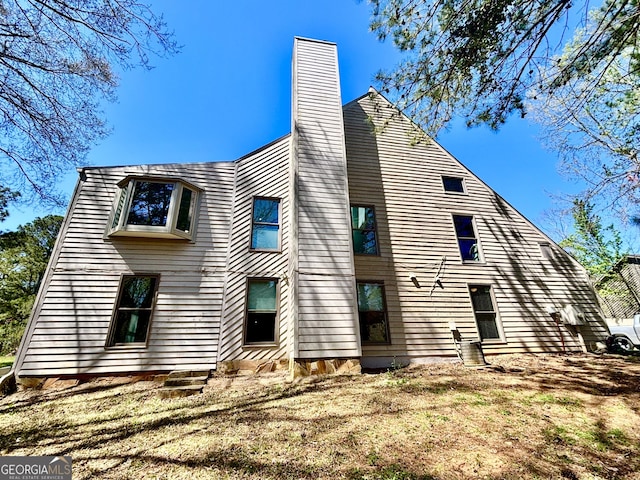 3810 Galloway Dr NE, Roswell, GA 30075 - back of house featuring a chimney