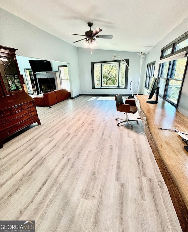 3810 Galloway Dr NE, Roswell, GA 30075 - living area featuring vaulted ceiling, a premium fireplace, wood finished floors, baseboards, and a ceiling fan