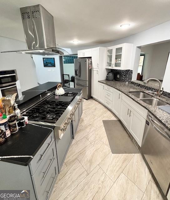 3810 Galloway Dr NE, Roswell, GA 30075 - kitchen featuring appliances with stainless steel finishes, a sink, island exhaust hood, and white cabinetry