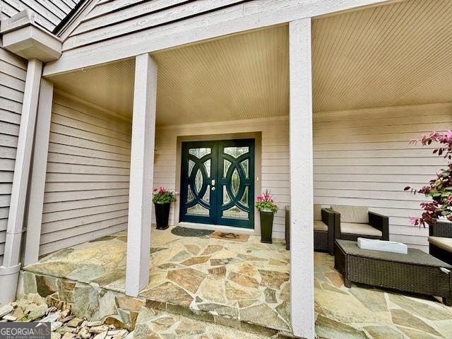 3810 Galloway Dr NE, Roswell, GA 30075 - view of exterior entry featuring a porch