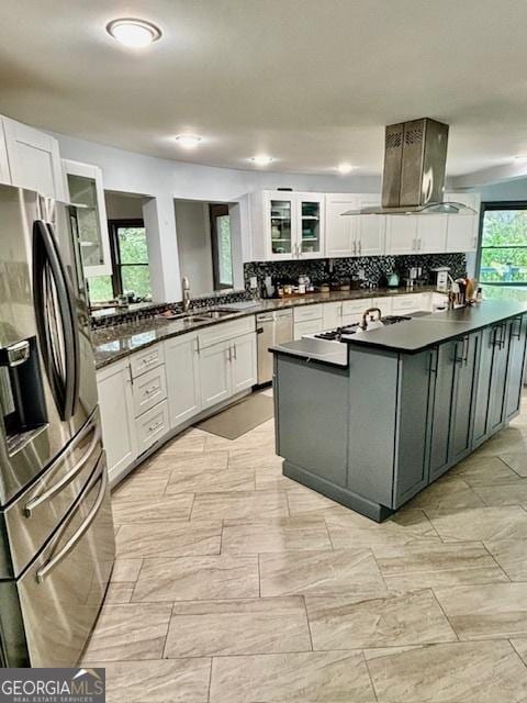 3810 Galloway Dr NE, Roswell, GA 30075 - kitchen with appliances with stainless steel finishes, island exhaust hood, dark countertops, and a sink