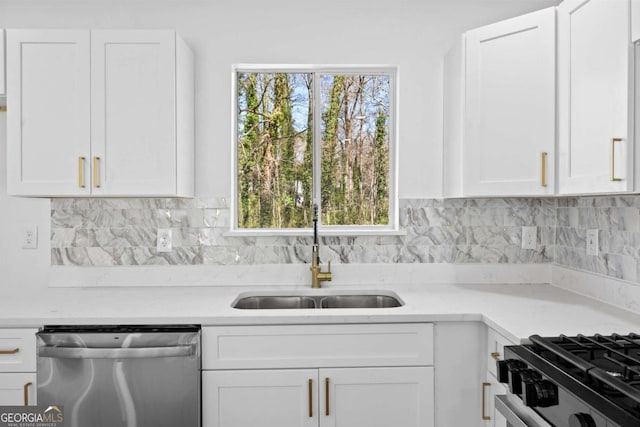 kitchen featuring a sink, white cabinetry, stainless steel dishwasher, and light countertops