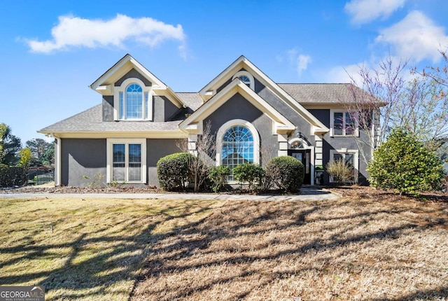 931 New Bedford Dr, Marietta, GA 30068 - view of front facade featuring stucco siding, a front lawn, and a shingled roof