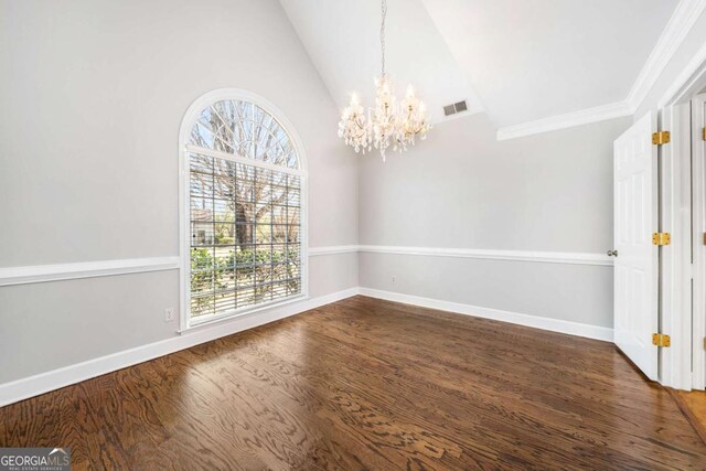 931 New Bedford Dr, Marietta, GA 30068 - unfurnished dining area with wood finished floors, baseboards, visible vents, an inviting chandelier, and vaulted ceiling