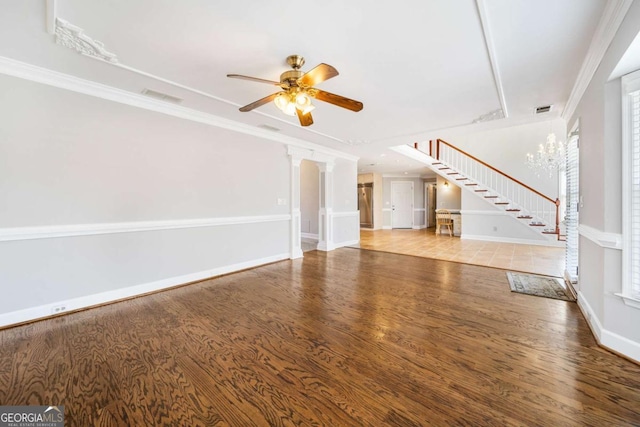 931 New Bedford Dr, Marietta, GA 30068 - unfurnished living room featuring stairs, wood finished floors, a ceiling fan, and visible vents