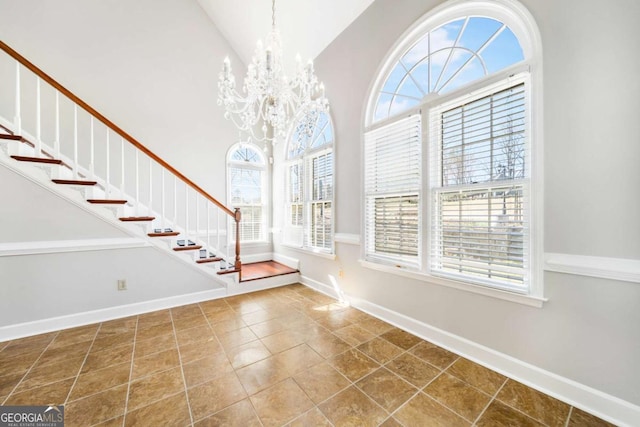 931 New Bedford Dr, Marietta, GA 30068 - entryway with a notable chandelier, a high ceiling, stairs, and baseboards