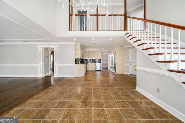931 New Bedford Dr, Marietta, GA 30068 - entryway with stairs, an inviting chandelier, and ornamental molding