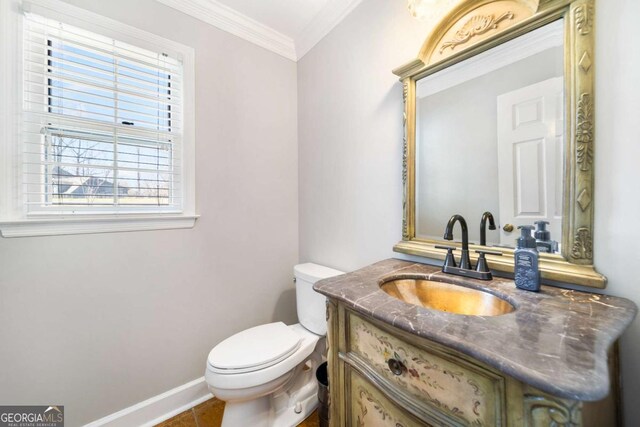 931 New Bedford Dr, Marietta, GA 30068 - half bathroom featuring vanity, baseboards, crown molding, toilet, and tile patterned floors