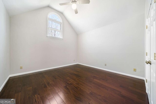 931 New Bedford Dr, Marietta, GA 30068 - additional living space with dark wood finished floors, baseboards, a ceiling fan, and vaulted ceiling