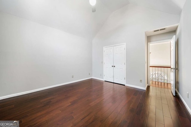 931 New Bedford Dr, Marietta, GA 30068 - unfurnished bedroom featuring baseboards, visible vents, dark wood-style flooring, and high vaulted ceiling