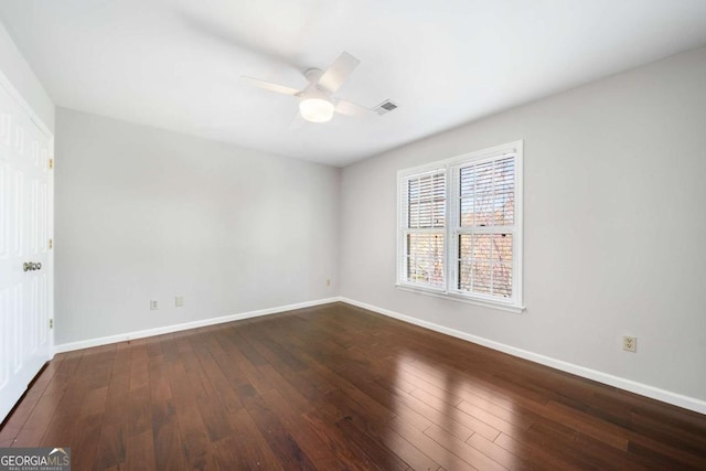 931 New Bedford Dr, Marietta, GA 30068 - spare room featuring dark wood finished floors, visible vents, baseboards, and ceiling fan