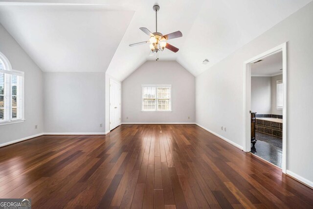 931 New Bedford Dr, Marietta, GA 30068 - unfurnished living room with baseboards, wood-type flooring, lofted ceiling, and a ceiling fan
