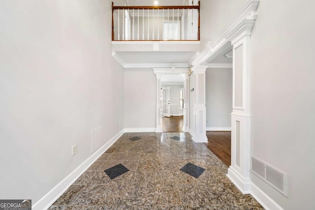 931 New Bedford Dr, Marietta, GA 30068 - entryway with granite finish floor, baseboards, visible vents, and ornate columns