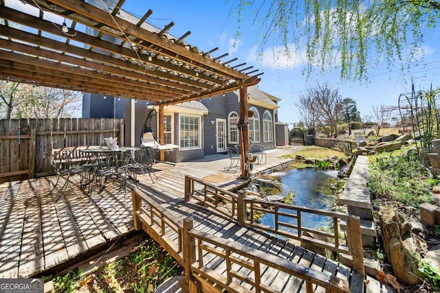 931 New Bedford Dr, Marietta, GA 30068 - deck with a pergola, outdoor dining area, and fence