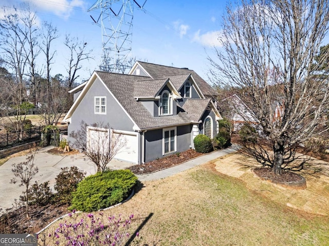 931 New Bedford Dr, Marietta, GA 30068 - traditional-style home featuring a shingled roof, concrete driveway, a front yard, stucco siding, and an attached garage