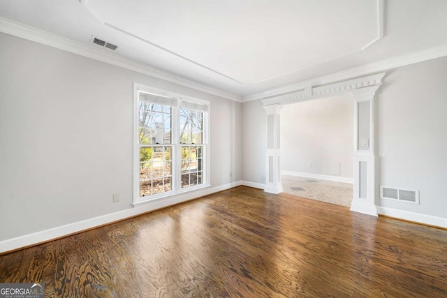 931 New Bedford Dr, Marietta, GA 30068 - unfurnished room featuring wood finished floors, visible vents, and ornamental molding
