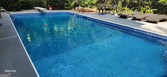 11637 Brown Bridge Rd, Covington, GA 30016 - view of pool with a diving board and a patio