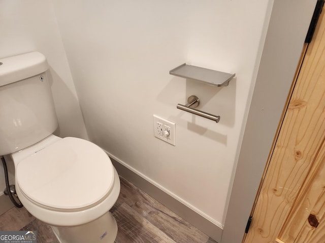 11637 Brown Bridge Rd, Covington, GA 30016 - bathroom featuring toilet and wood finished floors