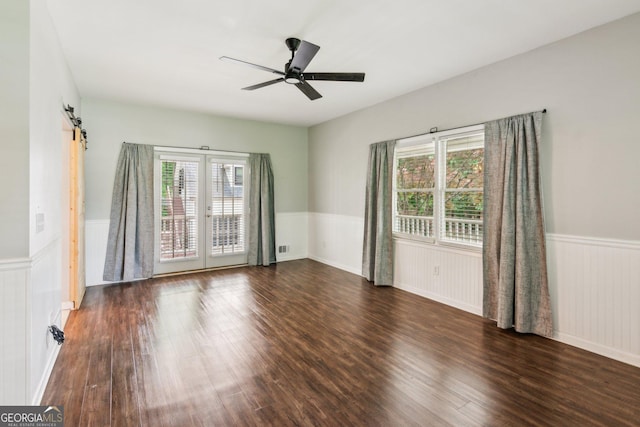 11637 Brown Bridge Rd, Covington, GA 30016 - empty room featuring a wainscoted wall, healthy amount of natural light, wood finished floors, and french doors