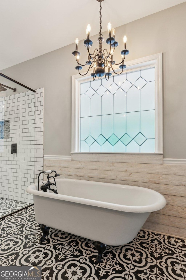 11637 Brown Bridge Rd, Covington, GA 30016 - bathroom featuring a chandelier, tiled shower, tile walls, a freestanding bath, and wainscoting