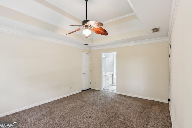 11637 Brown Bridge Rd, Covington, GA 30016 - spare room featuring a raised ceiling, ceiling fan, ornamental molding, and carpet