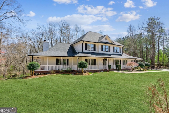 11637 Brown Bridge Rd, Covington, GA 30016 - farmhouse featuring covered porch, a chimney, and a front lawn