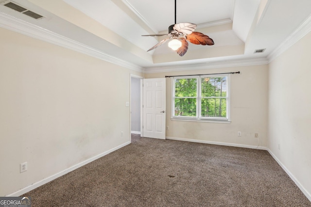 11637 Brown Bridge Rd, Covington, GA 30016 - spare room featuring a raised ceiling, carpet flooring, ornamental molding, and ceiling fan