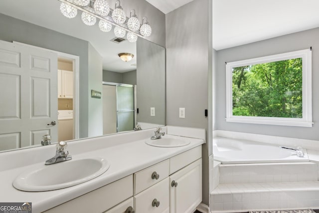 11637 Brown Bridge Rd, Covington, GA 30016 - bathroom with double vanity, a bath, and an enclosed shower