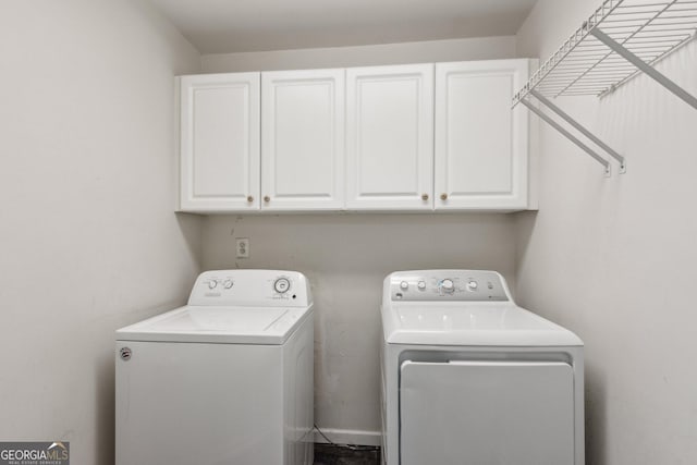 11637 Brown Bridge Rd, Covington, GA 30016 - washroom with cabinet space and washer and dryer