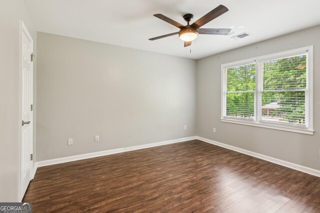 11637 Brown Bridge Rd, Covington, GA 30016 - spare room featuring ceiling fan and dark wood-style flooring