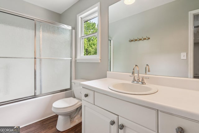 11637 Brown Bridge Rd, Covington, GA 30016 - bathroom featuring vanity, wood finished floors, and shower / bath combination with glass door